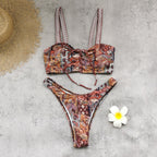 Two-piece printed swimwear set with lace-up bralette top and high-cut bottoms; paisley