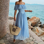 Blue off-shoulder ruffled maxi dress with gathered bodice and flowing tiered skirt