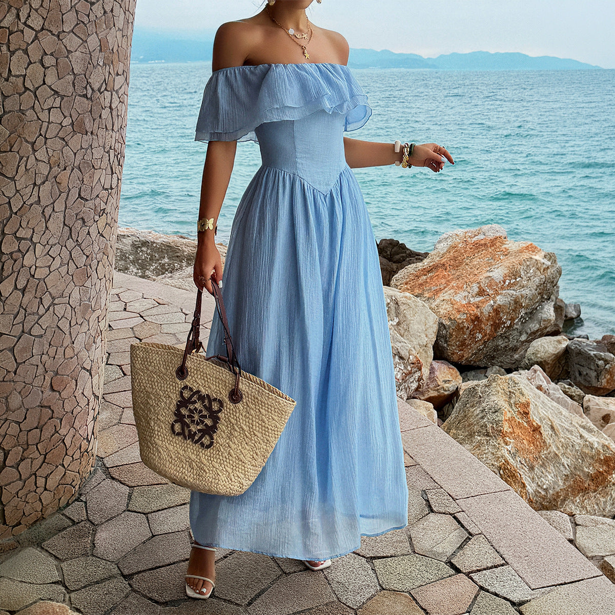 Blue off-shoulder ruffled maxi dress with gathered bodice and flowing tiered skirt