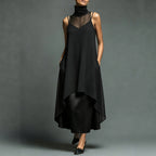 Black sleeveless dress with sheer front yoke and draped high-low hem