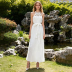 White sleeveless spring dress with scalloped lace yoke and tied waist, long pleated skirt