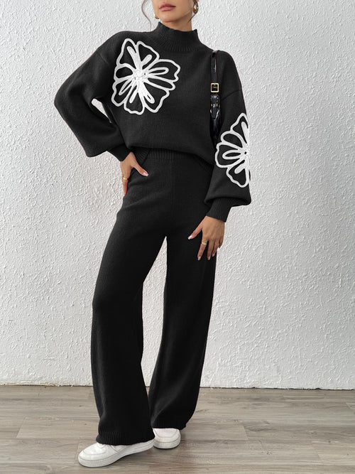 Two-piece sweater and wide-leg pants set in black with white floral ribbon embroidery