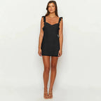 Black ruffled mini dress with scalloped shoulder ruffles and straight hemline