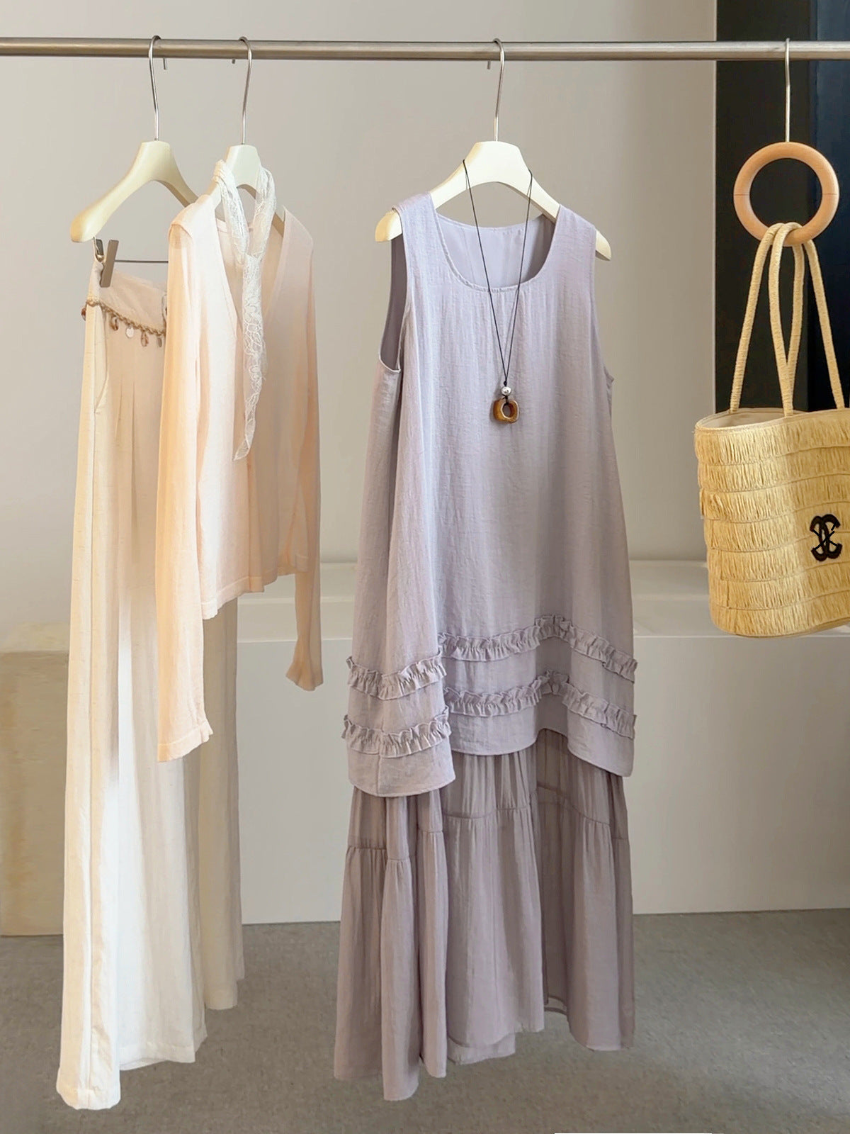 Lavender sleeveless summer dress with lace-trimmed hem and tiered skirt