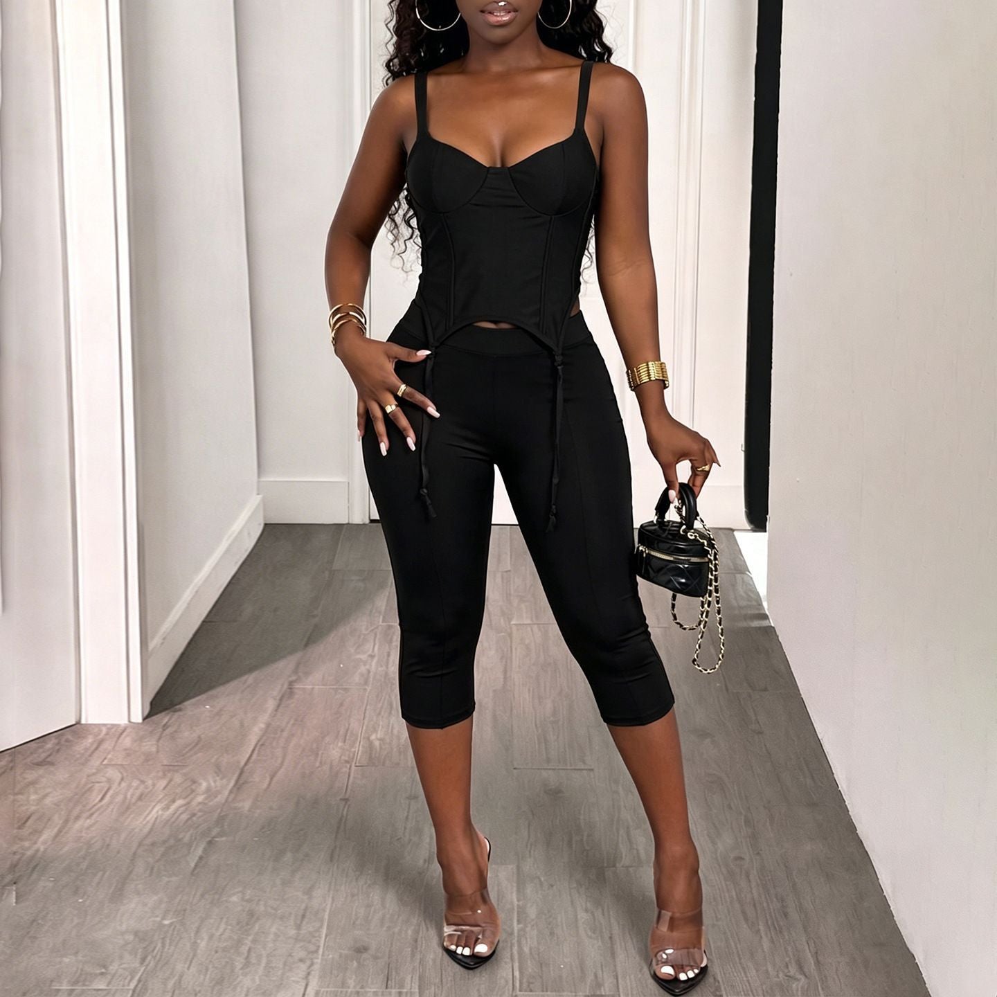 Black spaghetti-strap camisole and slim high-rise capri pants set