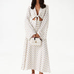 Women's polka dot long-sleeve dress with V-neck tie and midi length skirt