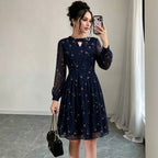 Navy chiffon long-sleeve dress with floral print, keyhole neckline, tiered skirt