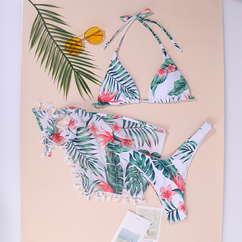 Green leaf and flower print triangle bikini-style one-piece with tassel trim and ties