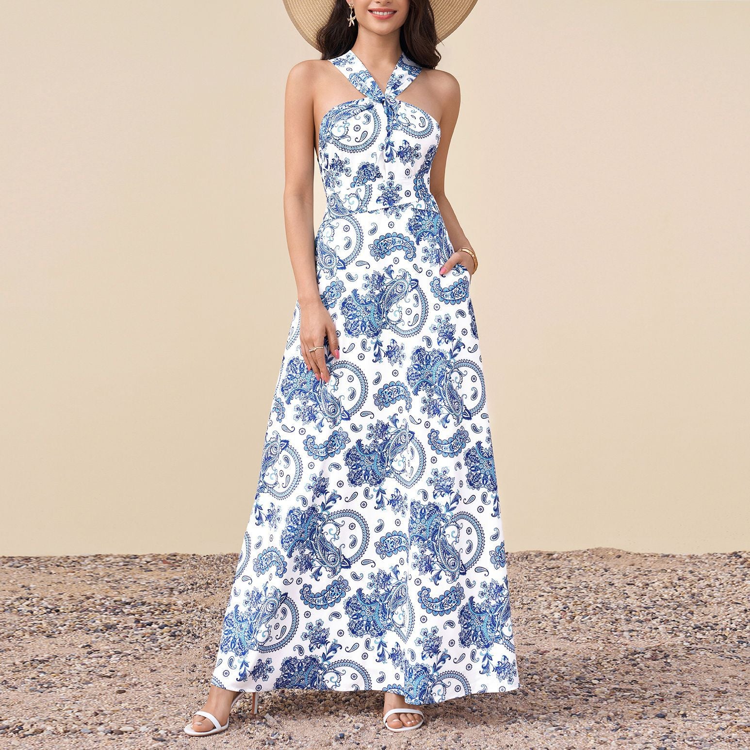Sleeveless halter maxi dress with blue-and-white paisley print