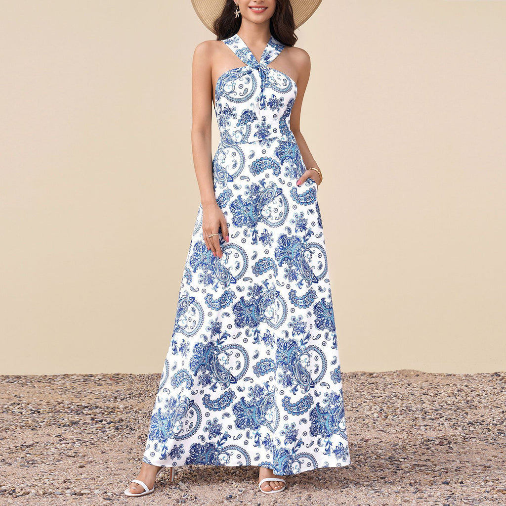 Halter neckline maxi dress with blue-and-white paisley print and tiered skirt