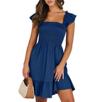 Women’s summer dress in navy blue with smocked square neckline and tiered skirt