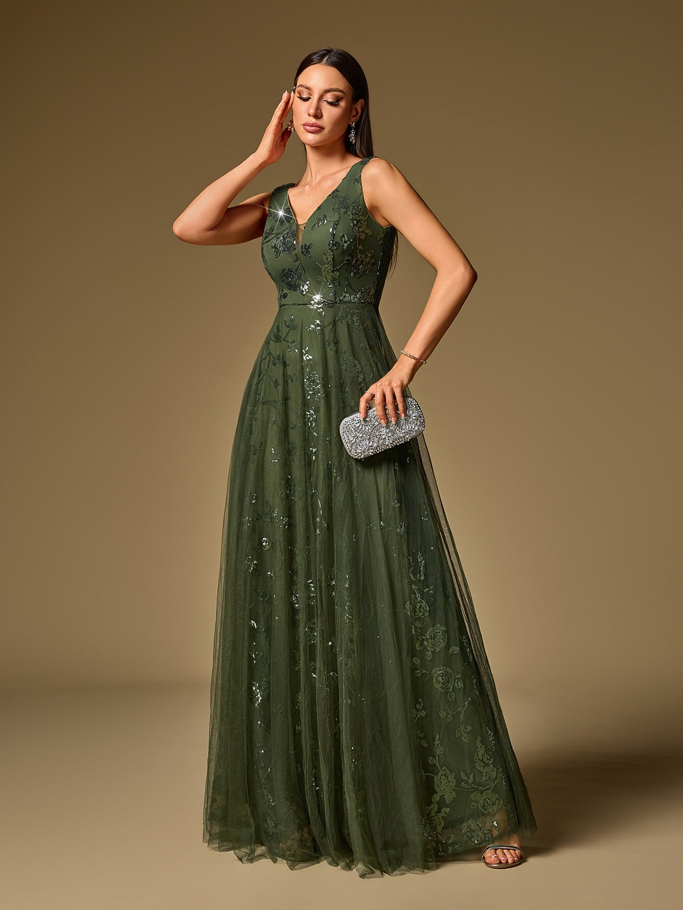 Green sleeveless sequin evening dress with V-neck, fitted waist, and full A-line skirt.