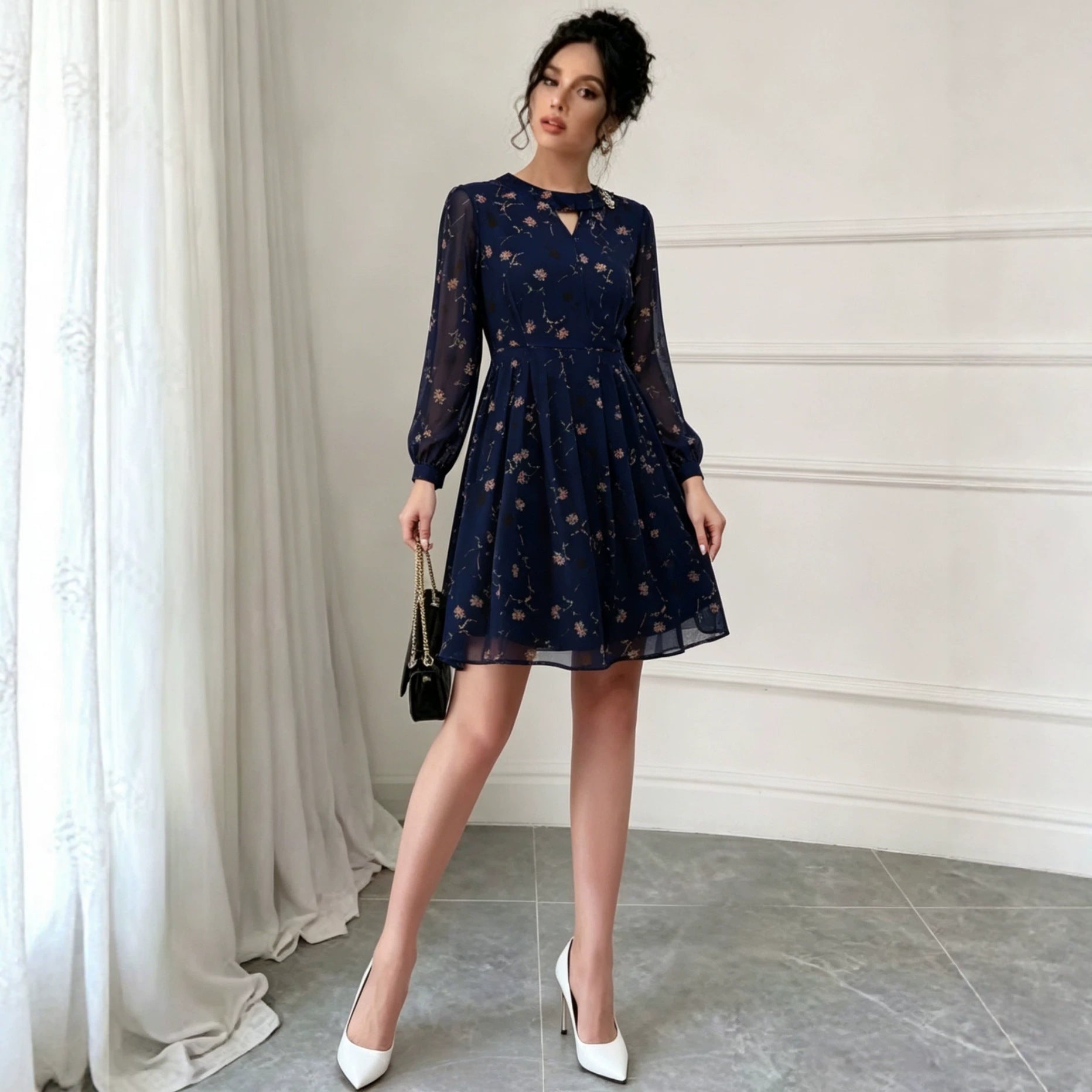 Navy chiffon long-sleeve dress with floral print, keyhole front, pleated skirt