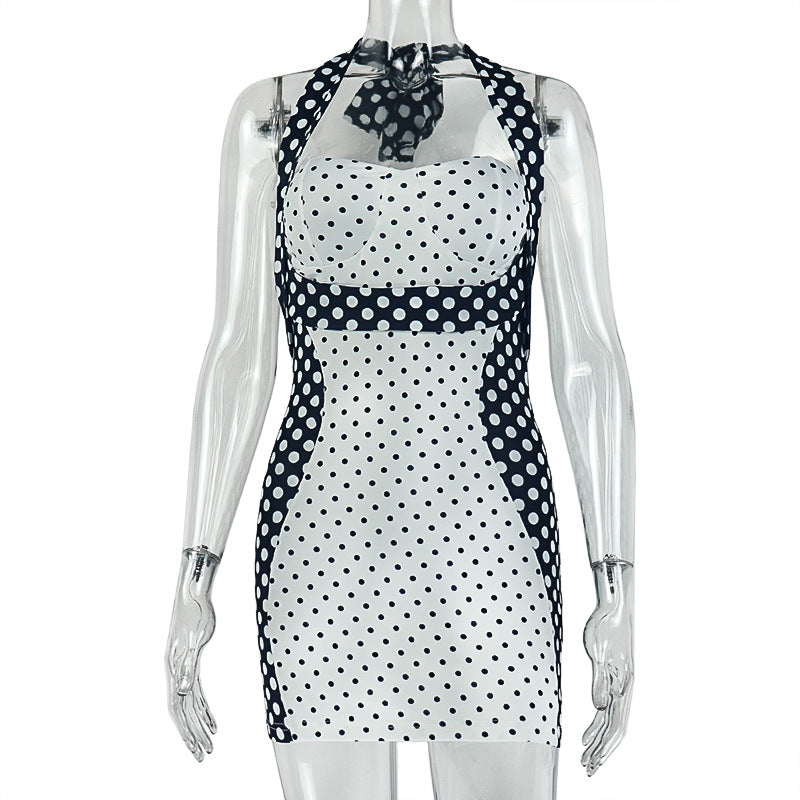 Women's halter wrap mini dress on mannequin, black-and-white polka-dot body and halter ties