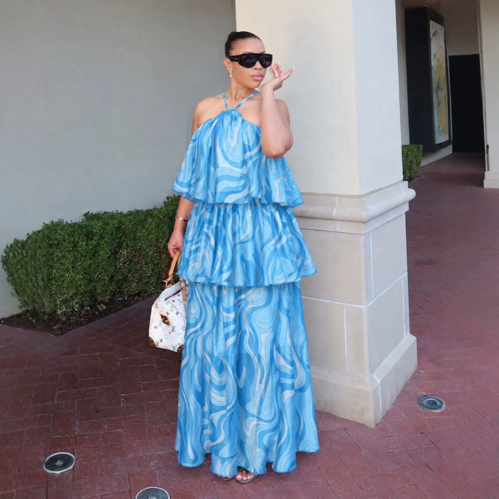 Women's halter tiered maxi dress in bright blue with abstract swirl pattern