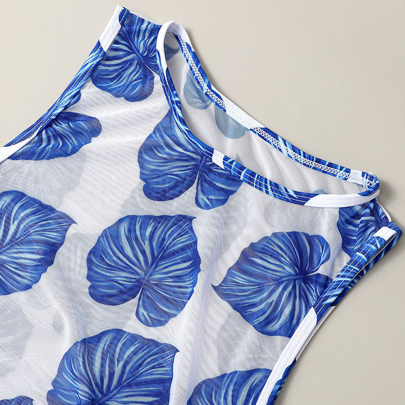 Blue-and-white leaf-pattern swimsuit fabric with blue-trim halter neckline
