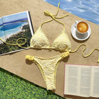 Yellow floral-embroidered triangle bikini top with matching high-cut bottoms