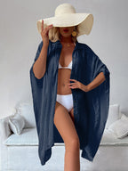 Navy bamboo cotton cover-up shirt with short sleeves, button front, draped hem.