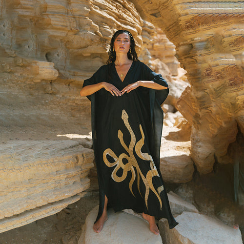 Black beach dress cover-up with V-neck and short sleeves, gold patterned hem