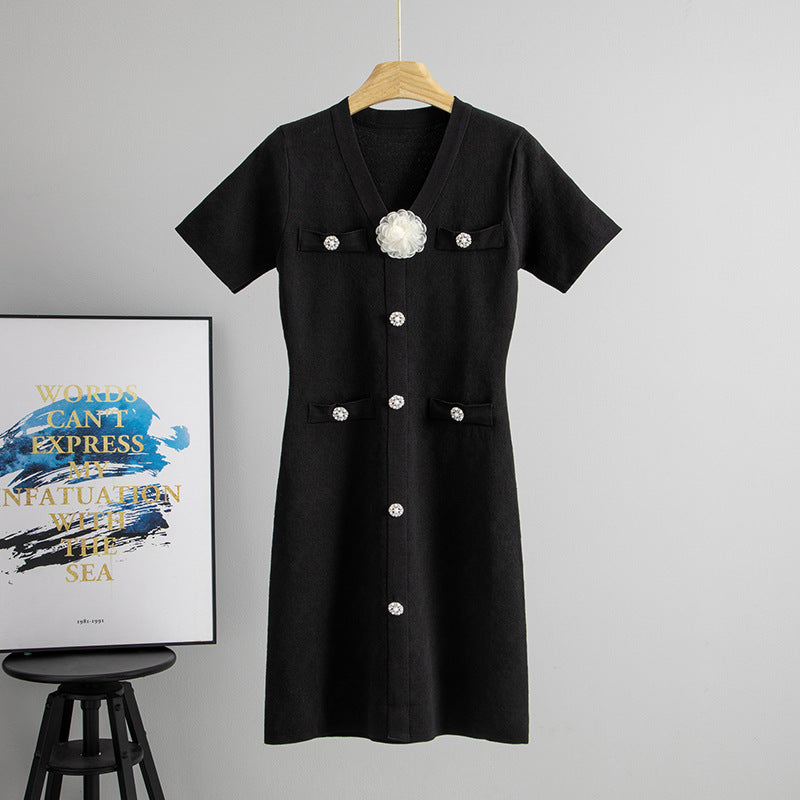 Black midi knit dress with V-neck, short sleeves, button front and floral chest detail
