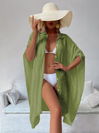 Green bamboo cotton cover-up shirt with collar and button front, loose fit with draped sleeves.