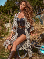 Black lace cardigan with open front, long sleeves, and floral pattern