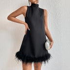 Black sleeveless half-turtleneck A-line mini dress with feather-trim frayed hem