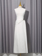 Ivory high-neck sleeveless midi dress on mannequin with side waist tie