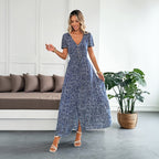 Women's blue polka dot maxi dress with V-neck, short sleeves, ruffle hem
