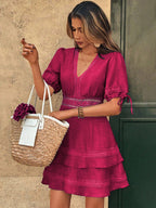 Magenta lace short-sleeve V-neck dress with tiered skirt and ruffled hem