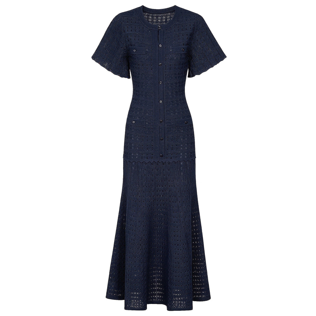 Navy maxi silk dress with short sleeves, button-front placket, and textured crochet-style skirt.