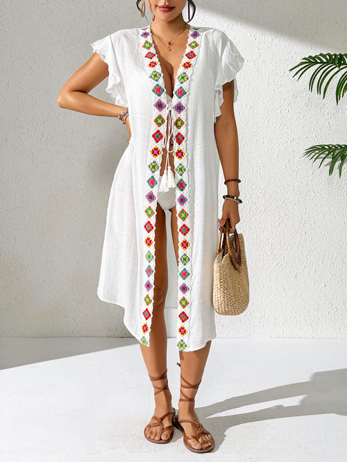 White beach cover-up with central colorful embroidery and relaxed knee-length fit