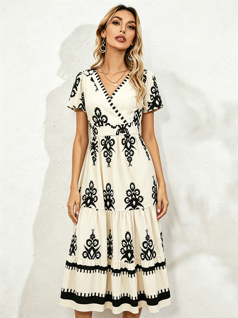 Cream midi short-sleeve dress with V-neck and black floral embroidery, tiered skirt