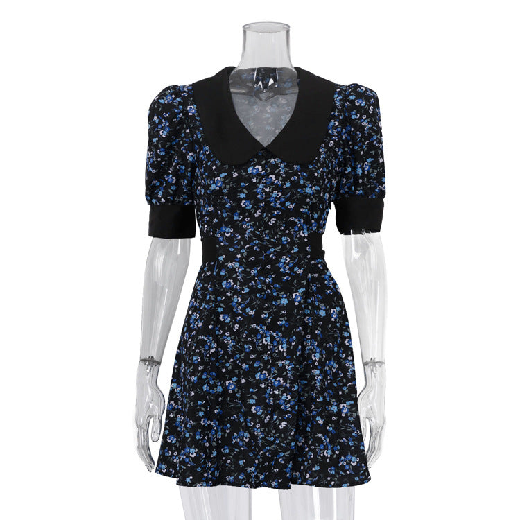 Black floral V-neck mini dress with puffed short sleeves and fitted bodice