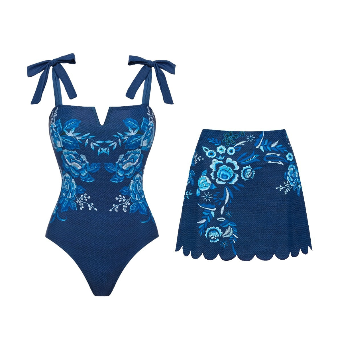 Blue floral one-piece swimsuit with bow straps and scalloped skirt bottom