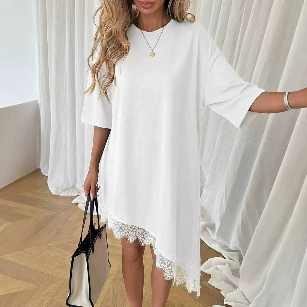 White loose shift dress with short sleeves and scalloped lace hem detail