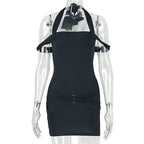 Black backless halter mini dress on mannequin with halter straps