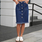 Midnight navy denim skirt with button-front, front pockets, and frayed hem