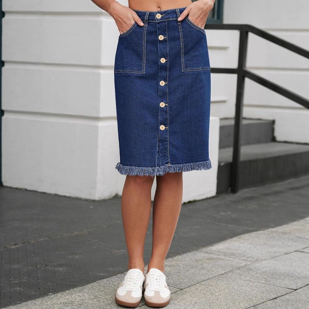 Midnight navy denim skirt with button-front, front pockets, and frayed hem