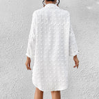 White button-up swim cover-up tunic, back view with long sleeves and textured pattern