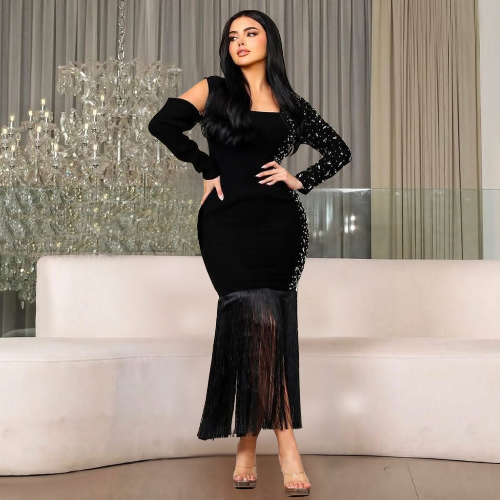 Black long-sleeve bodycon dress with cutout shoulder and fringed trumpet hem