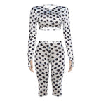 White polka dot long-sleeve crop top and capri leggings set, front view