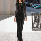 Black velvet maxi dress, fitted silhouette with long sleeves, curved seam detailing