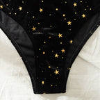 Black high-rise bikini bottoms with gold star pattern and full coverage back