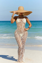White halter mesh bodycon dress with cutout lattice pattern and open-back styling