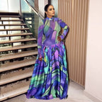 Purple and teal floral long-sleeve maxi dress with high neckline and gathered skirt