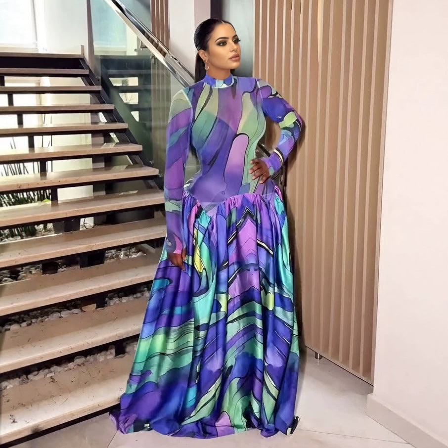 Purple and teal floral long-sleeve maxi dress with high neckline and gathered skirt