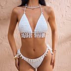White crochet triangle bikini top with tassel trim and matching tie-side bottoms