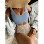 One-piece swimsuit with sky blue scoop top and speckled bikini briefs, seamless fit