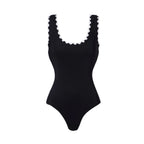 Dark one-piece swimsuit with white scalloped U-neck and scalloped straps